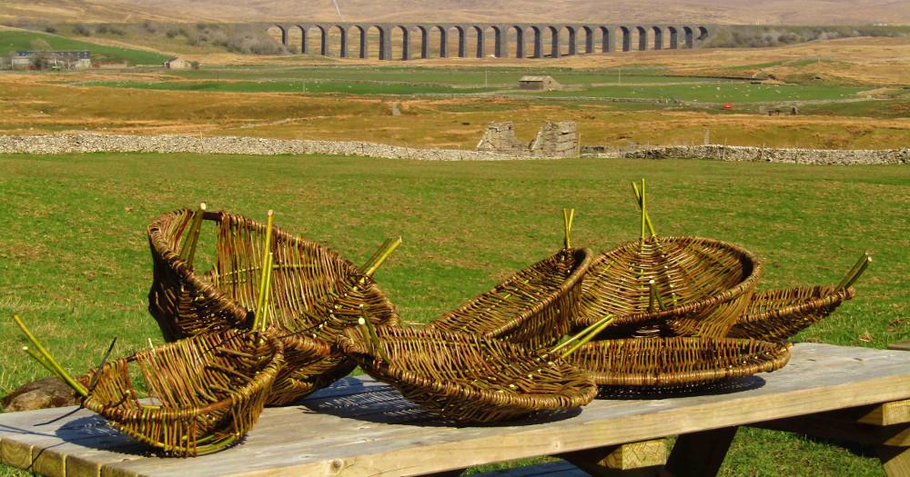 willow baskets with Ribblehead Viaduct behind