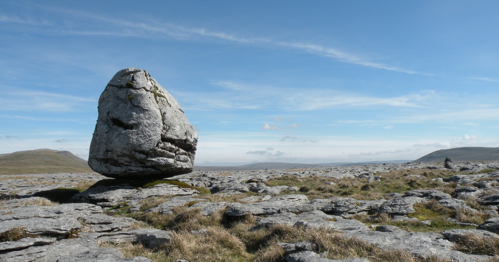 Boulder on limestone pavement